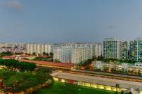 High density residential housing towers next to mass rapid transit train line in Singapore